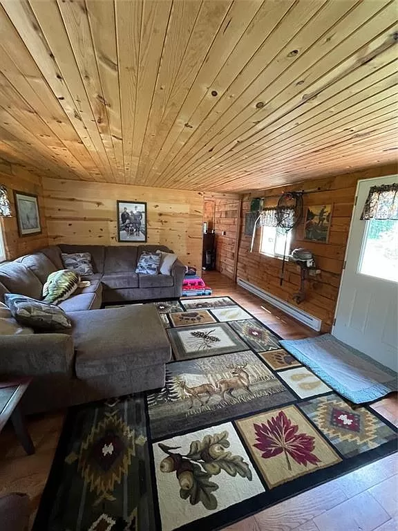 Rustic log home on Bog Lake. 6 acres. $164,900 – Adorable Living Spaces