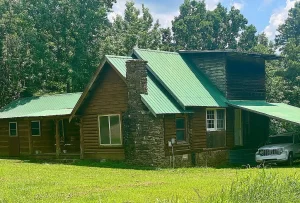 Expansive 42-Acre Homestead with Rustic Log Cabin & Orchard. $269,900